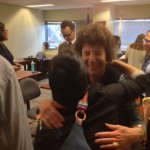 Rebecca Gibson, a lecturer at Tufts, celebrates the victory at the NLRB offices.